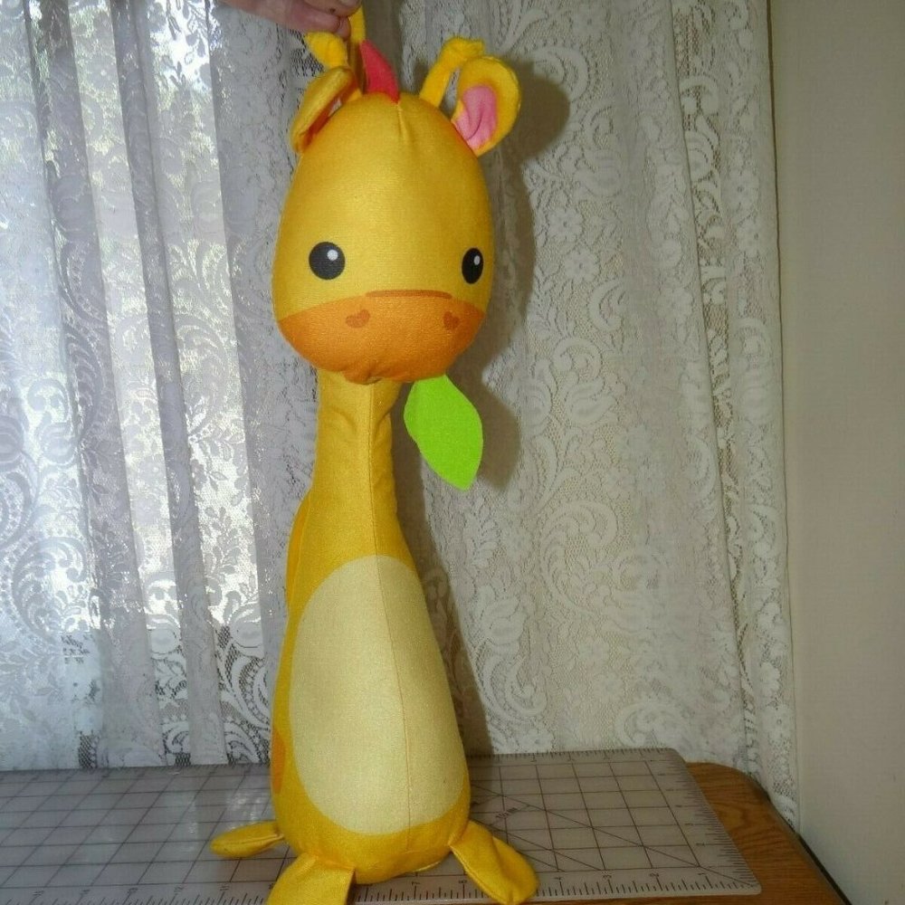 Fisher Price Giraffe ties to crib